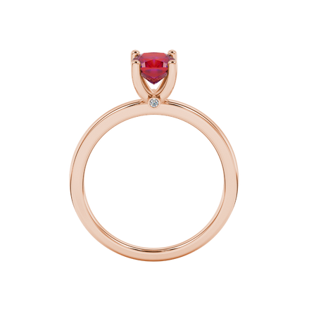 Red cushion cut solitaire gemstone ring with accent diamonds in rose gold four prong setting
