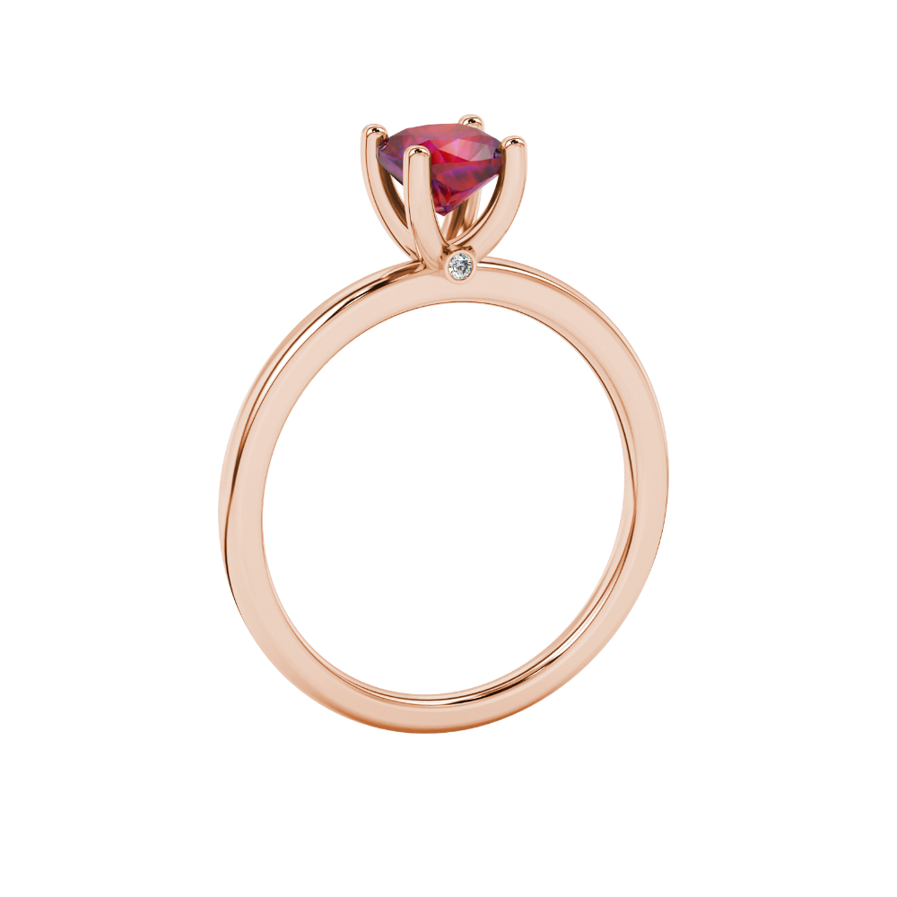 Red cushion cut solitaire gemstone ring with accent diamonds in rose gold four prong setting