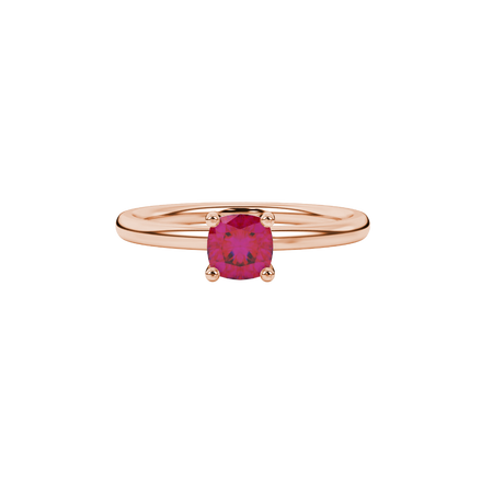 Red cushion cut solitaire gemstone ring with accent diamonds in rose gold four prong setting