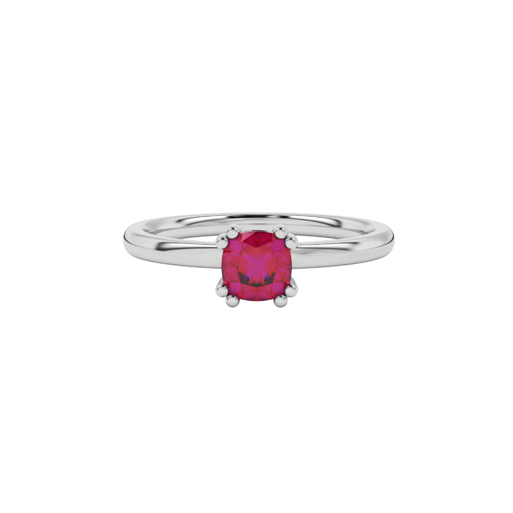 Red cushion cut solitaire gemstone ring in six-prong gold setting with slim stackable band