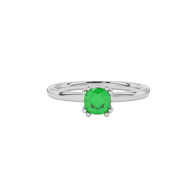 Green cushion cut solitaire gemstone ring in six-prong gold setting with slim stackable band