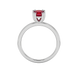 Red cushion cut solitaire gemstone ring in six-prong gold setting with slim stackable band