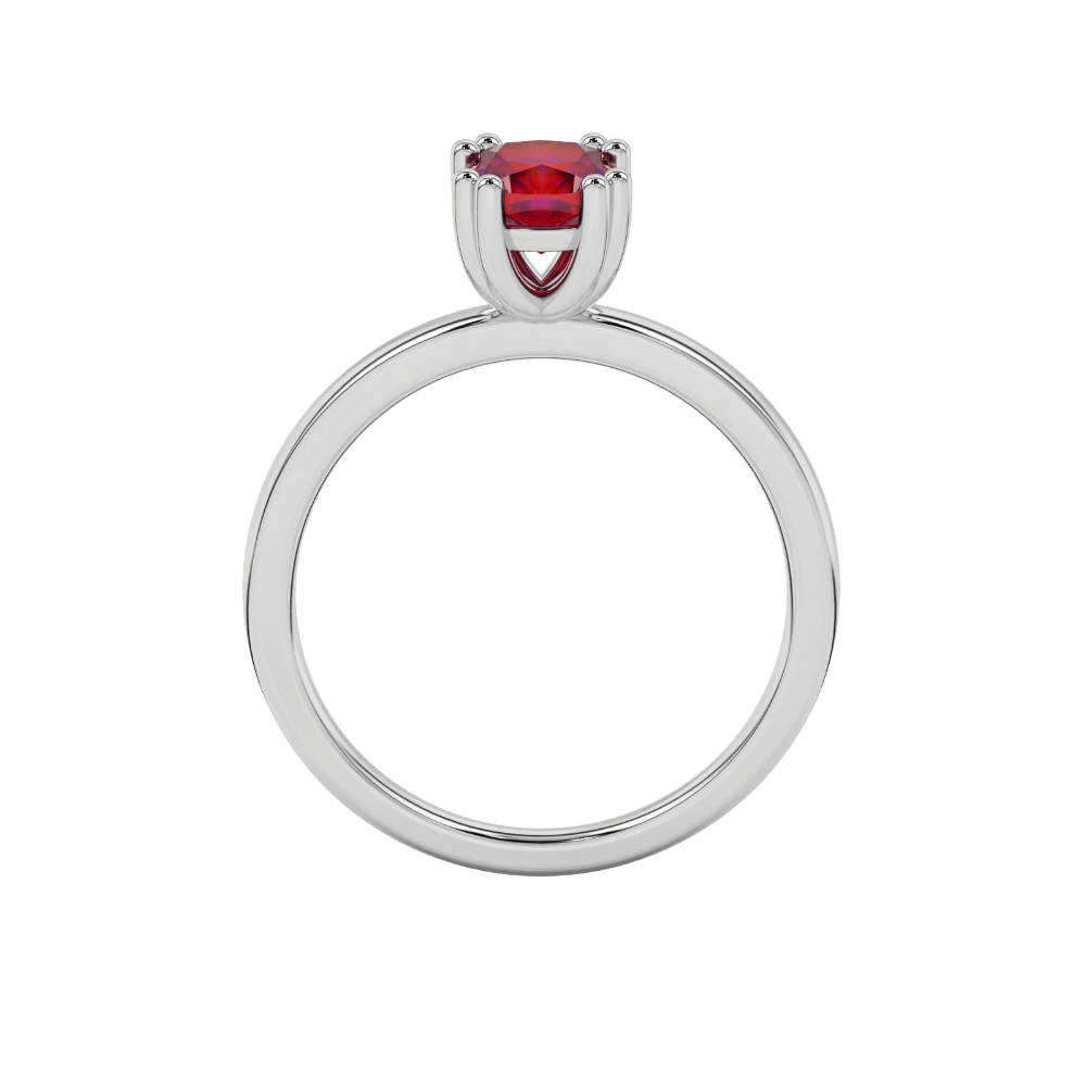 Red cushion cut solitaire gemstone ring in six-prong gold setting with slim stackable band