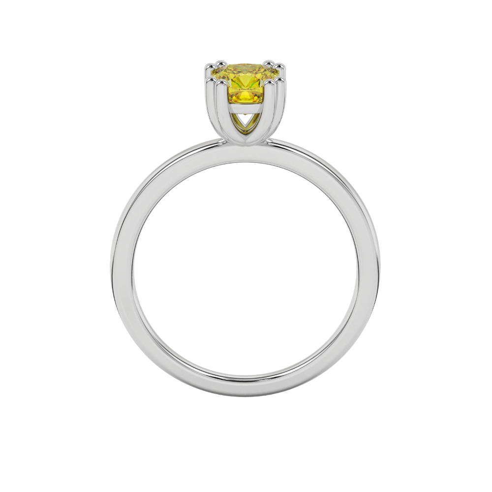 Yellow cushion cut solitaire gemstone ring in six-prong gold setting with slim stackable band