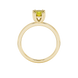 Yellow cushion cut solitaire gemstone ring in six-prong gold setting with slim stackable band