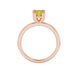 Yellow cushion cut solitaire gemstone ring in six-prong gold setting with slim stackable band