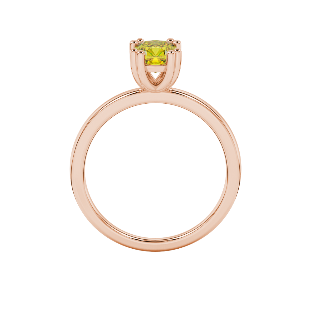 Yellow cushion cut solitaire gemstone ring in six-prong gold setting with slim stackable band