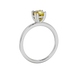 Yellow cushion cut solitaire gemstone ring in six-prong gold setting with slim stackable band