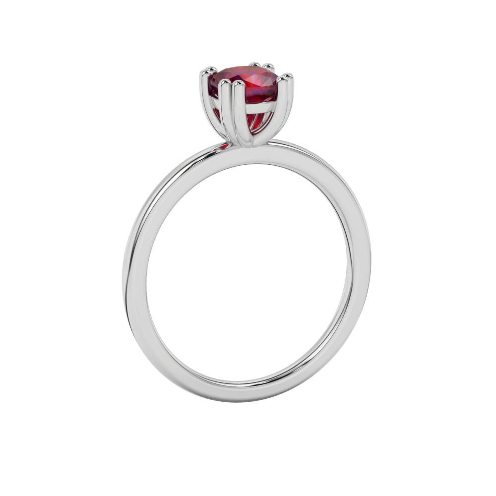 Red cushion cut solitaire gemstone ring in six-prong gold setting with slim stackable band