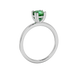 Green cushion cut solitaire gemstone ring in six-prong gold setting with slim stackable band