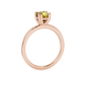 Yellow cushion cut solitaire gemstone ring in six-prong gold setting with slim stackable band