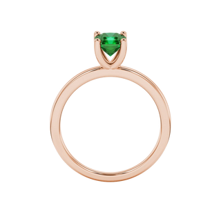 Radiant-cut emerald green gemstone solitaire ring in a rose gold four-prong setting