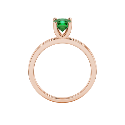 Radiant-cut emerald green gemstone solitaire ring in a rose gold four-prong setting