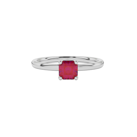 Side view of a white gold raspberry red gemstone ring featuring a clean classic basket gallery.