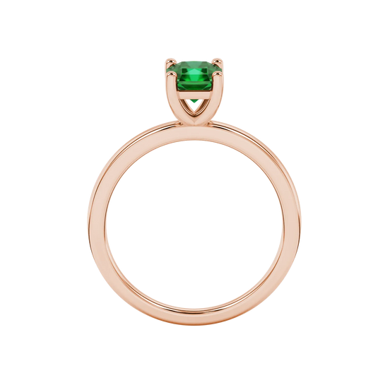 Radiant-cut emerald green gemstone solitaire ring in a rose gold classic basket setting.
