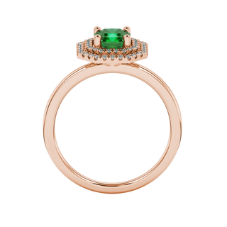 Radiant-cut emerald green gemstone solitaire ring in a rose gold falling edge halo setting.