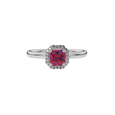 close-up of a radiant raspberry red gemstone enclosed in a white gold french pavé halo ring setting.