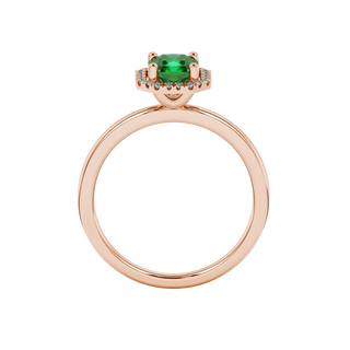 Radiant-cut emerald green gemstone solitaire ring in a rose gold french pavé halo setting