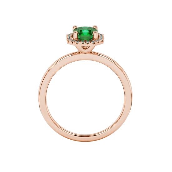 Radiant-cut emerald green gemstone solitaire ring in a rose gold french pavé halo setting