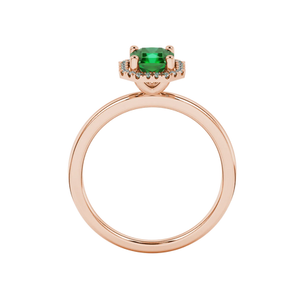 Radiant-cut emerald green gemstone solitaire ring in a rose gold french pavé halo setting