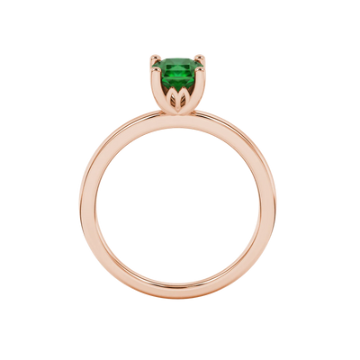 Radiant-cut emerald green gemstone solitaire ring in a rose gold lotus basket setting