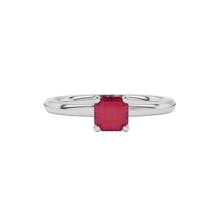 close-up of a radiant raspberry red gemstone enclosed in a white gold pavé basket ring setting.
