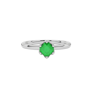 Close-up details of a radiant emerald green gemstone secured in a white gold scalloped six-prong ring.