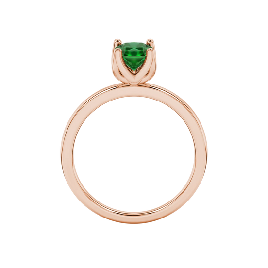 Radiant-cut emerald green gemstone solitaire ring in a rose gold tulip basket setting.