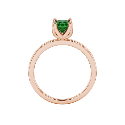 Radiant-cut emerald green gemstone solitaire ring in a rose gold tulip basket setting.