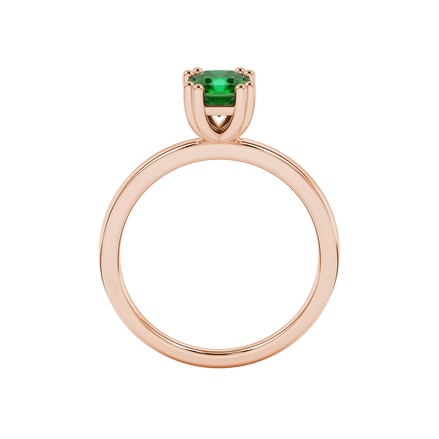 Radiant-cut emerald green gemstone solitaire ring in a rose gold vintage basket setting.