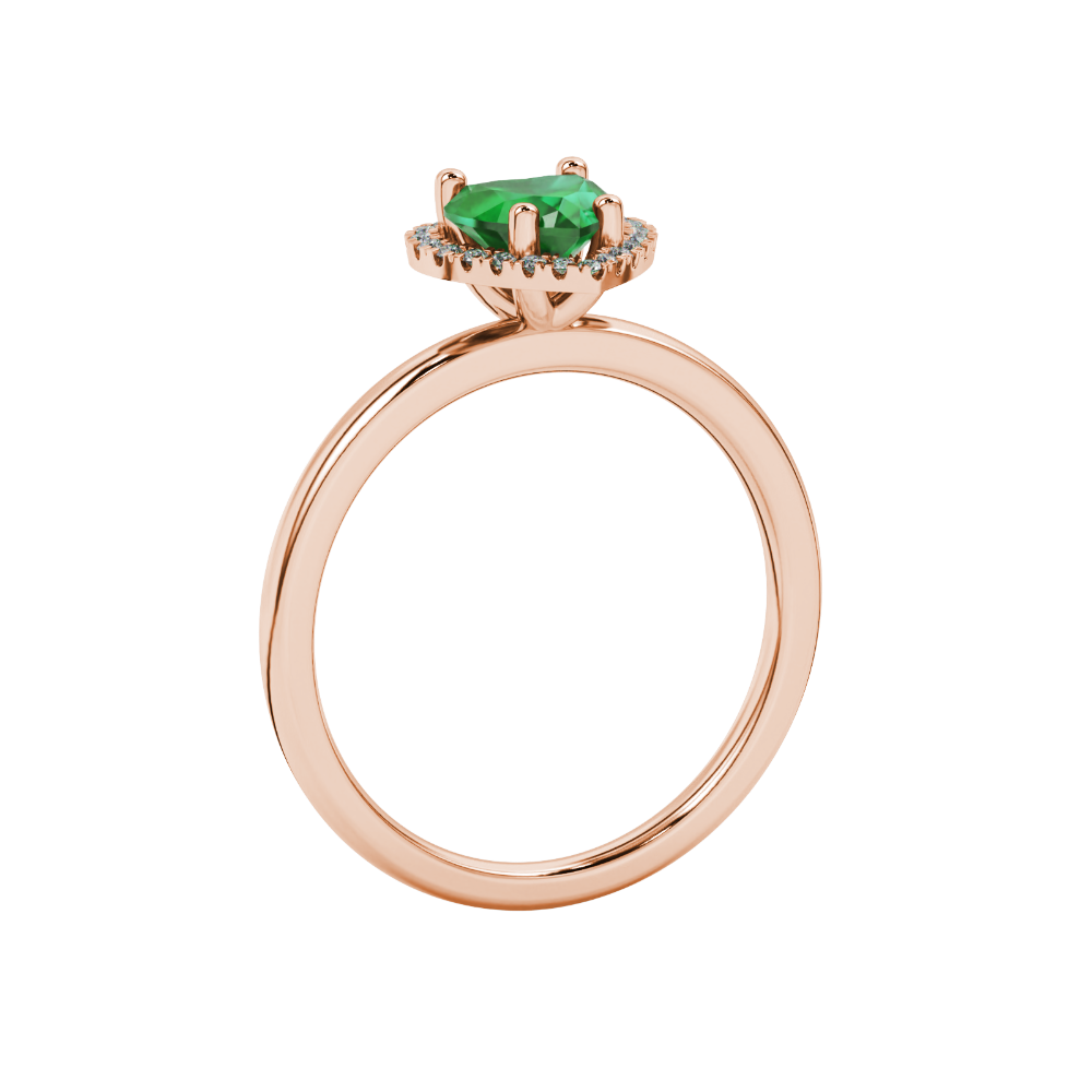 Side view of Emerald Green heart cut gemstone halo ring in rose gold