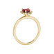 Side view of Raspberry Red heart cut gemstone halo ring in yellow gold