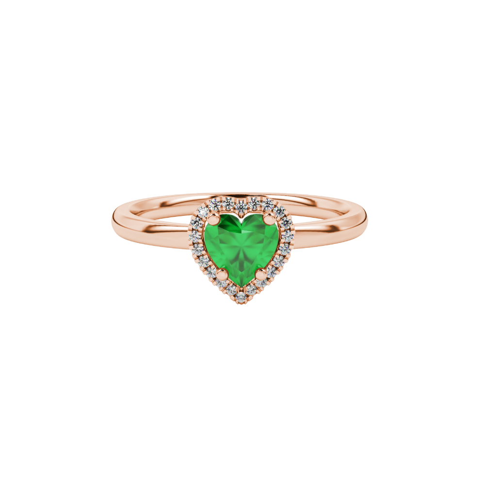 Close-up angled shot of Emerald Green heart cut halo ring in rose gold on finger