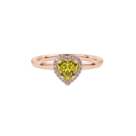 Close-up angled shot of Canary Yellow heart cut halo ring in rose gold on finger