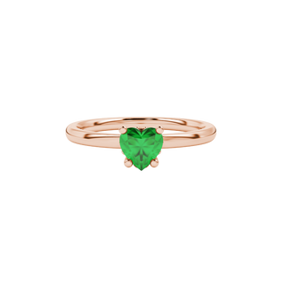 Close-up angled shot of Emerald Green heart cut lotus basket halo ring in rose gold