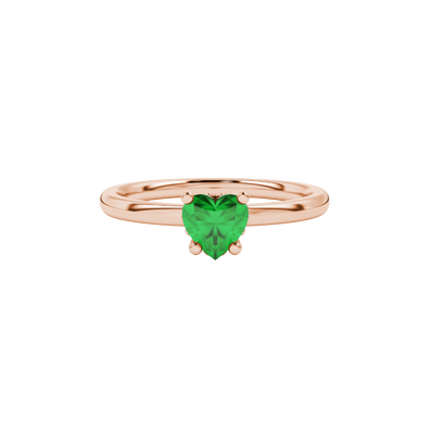Close-up angled shot of Emerald Green heart cut lotus basket halo ring in rose gold