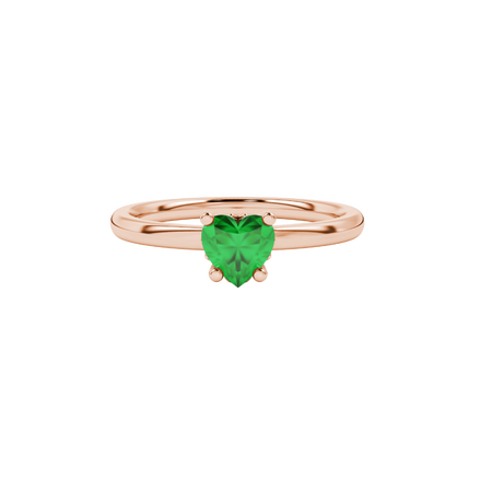 Close-up angled shot of Emerald Green heart cut lotus basket halo ring in rose gold