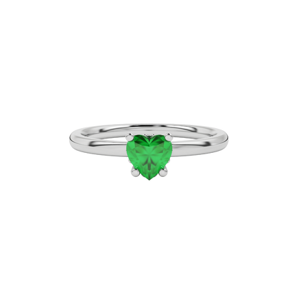 Close-up angled shot of Emerald Green heart cut lotus basket halo ring in white gold