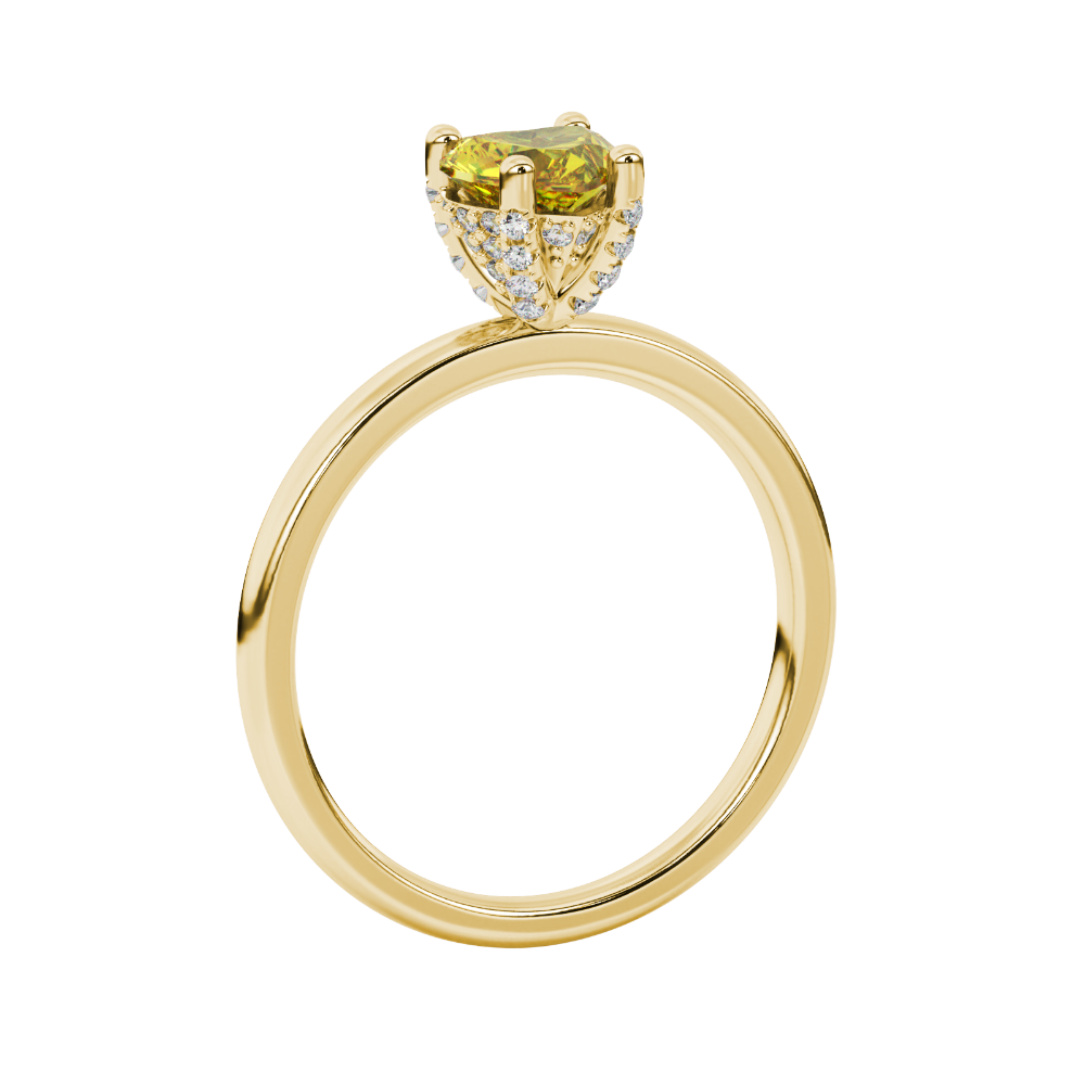 Side view of a yellow gold heart gemstone ring showcasing the elegant diamond pavé basket gallery