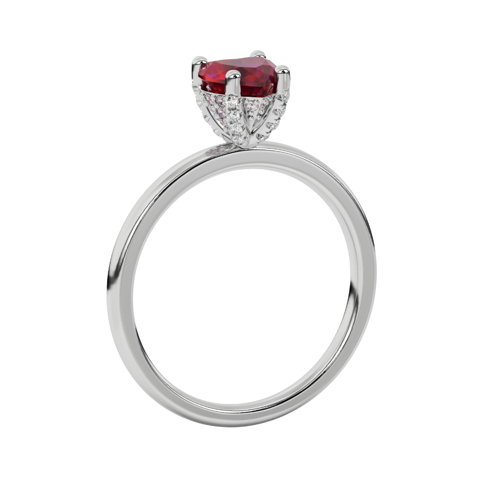Side profile of a white gold heart gemstone ring showing the detailed diamond pavé basket gallery.