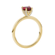 Side angle of a yellow gold heart gemstone ring highlighting the brilliant diamond pavé basket.