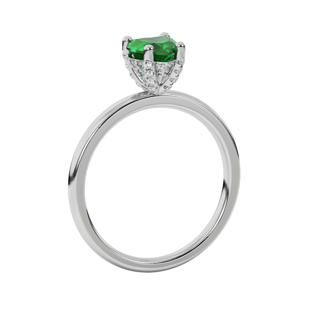 Side angle of a white gold heart gemstone ring showcasing the detailed diamond pavé basket gallery