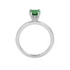 Heart-cut emerald green gemstone solitaire ring in a white gold