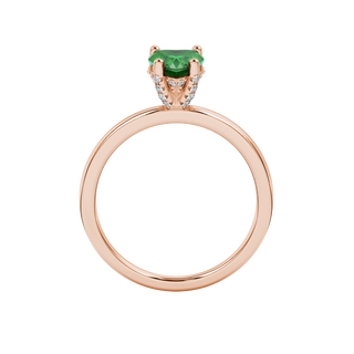 Heart-cut emerald green gemstone solitaire ring in a rose gold
