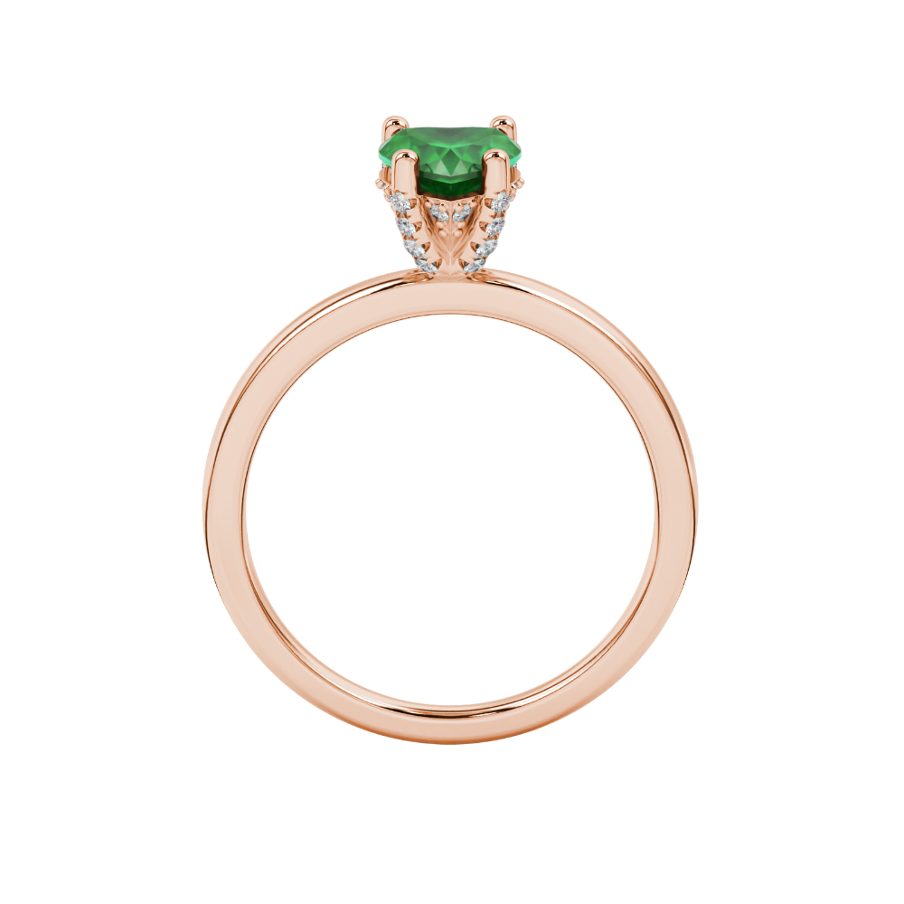 Heart-cut emerald green gemstone solitaire ring in a rose gold