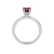 Heart-cut raspberry red gemstone solitaire ring in a white gold four-prong setting.