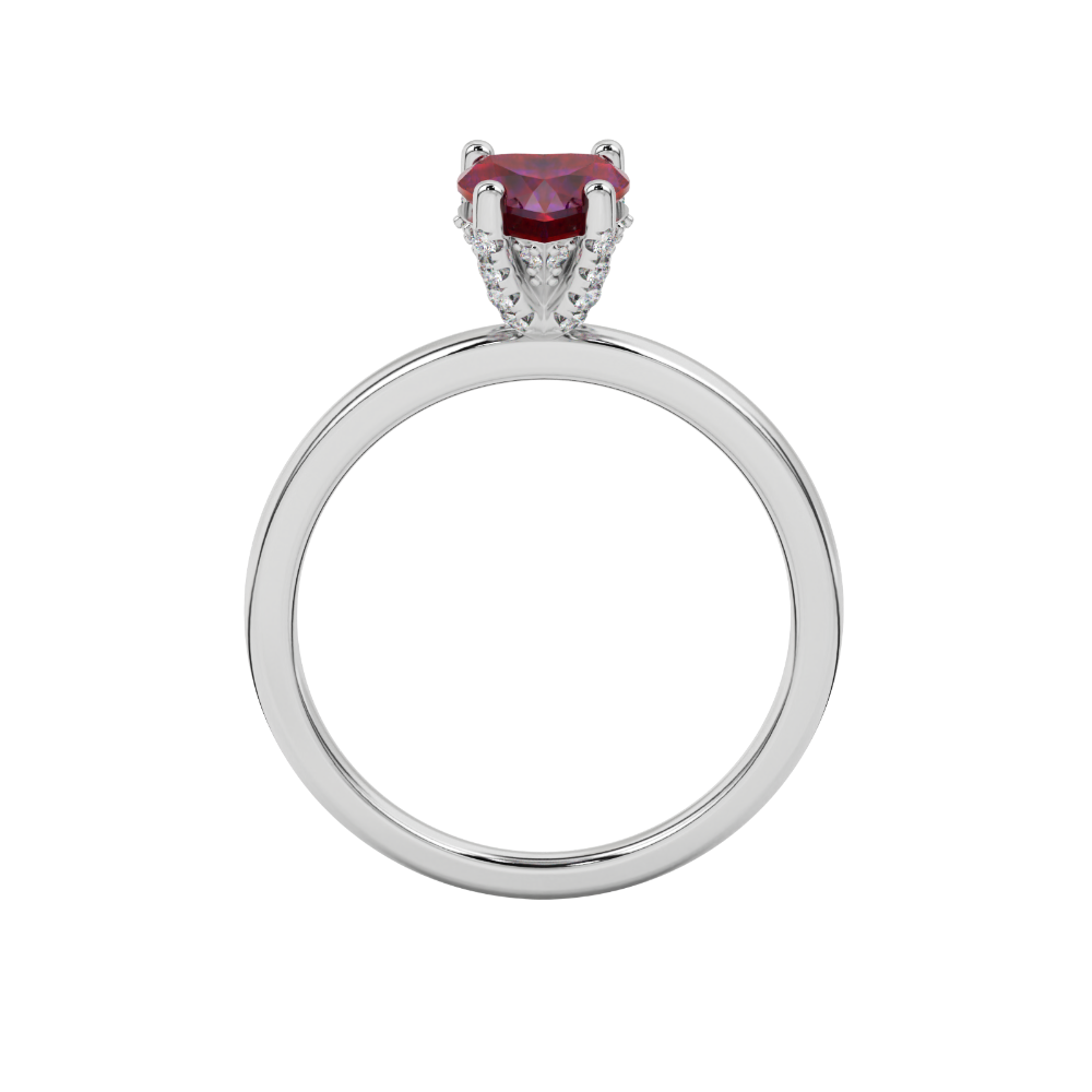 Heart-cut raspberry red gemstone solitaire ring in a white gold four-prong setting.