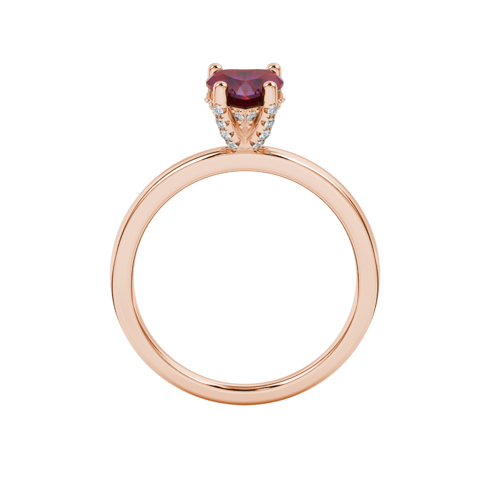 Heart-cut raspberry red gemstone solitaire ring in a rose gol