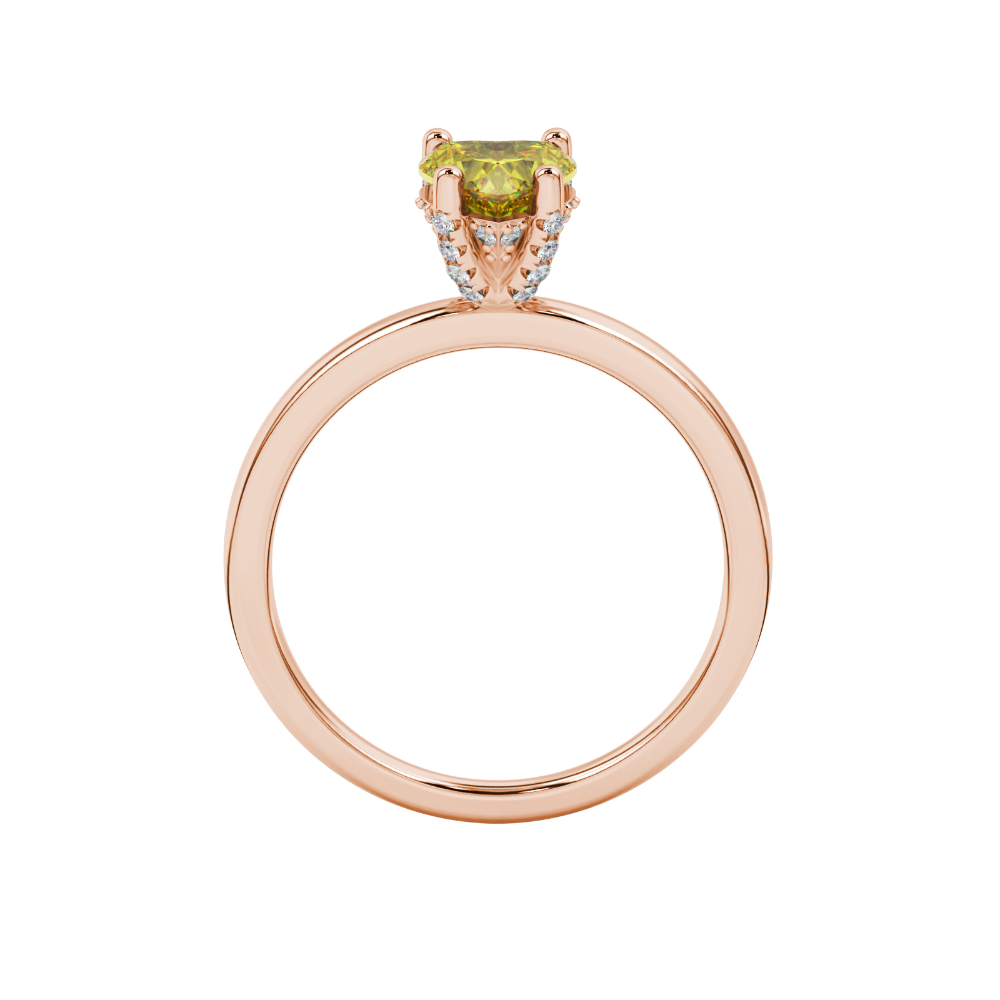 Heart-cut canary yellow gemstone solitaire ring in a rose gold four-prong setting.