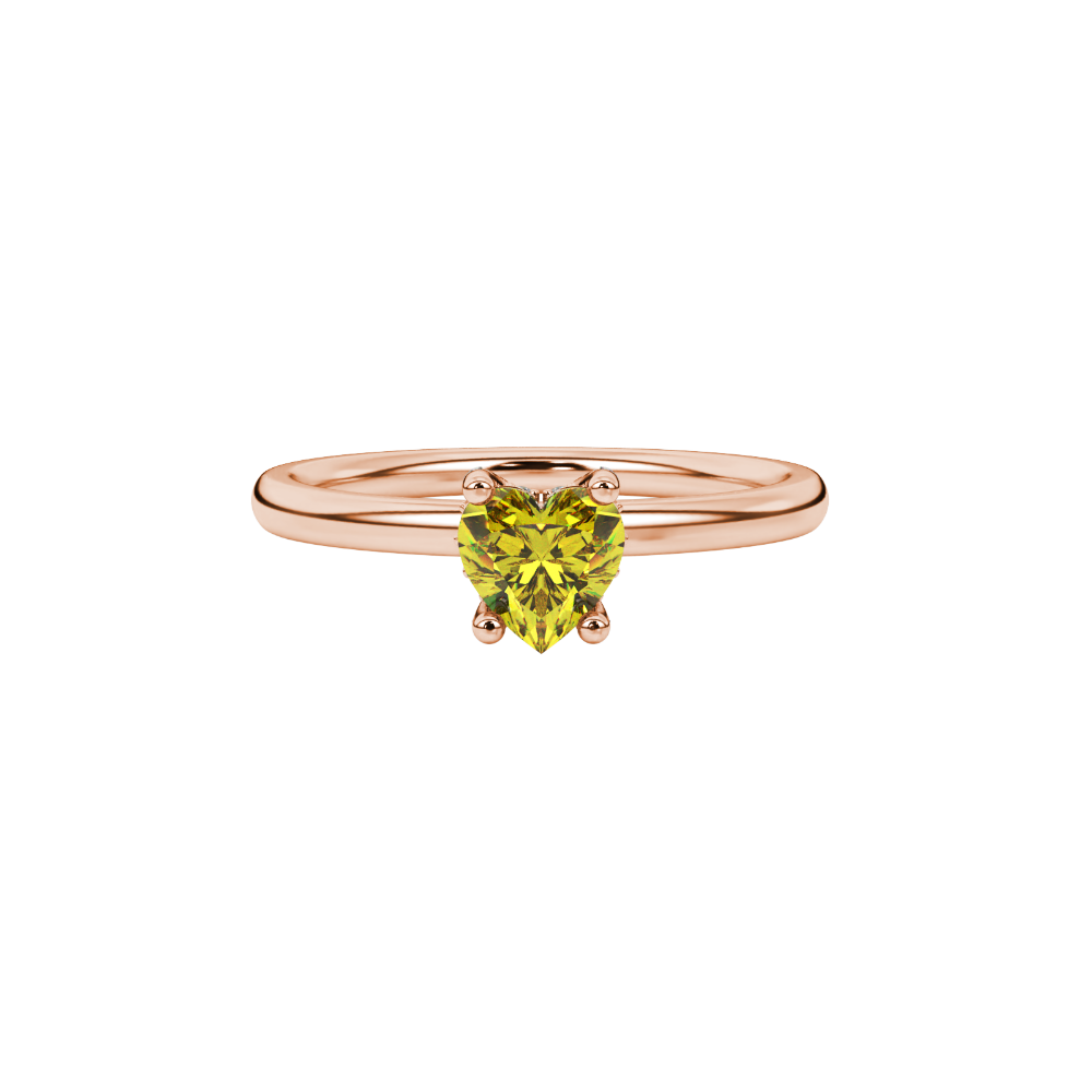 Close-up shot of a heart-shaped canary yellow gemstone with an intricate diamond pavé basket in rose gold.